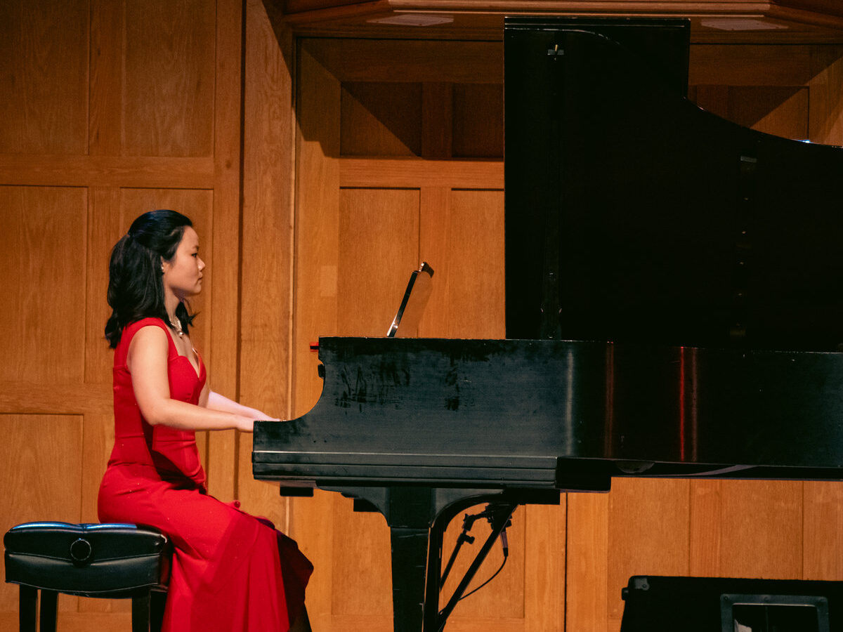 Song Chen performing at a grand piano on a concert stage