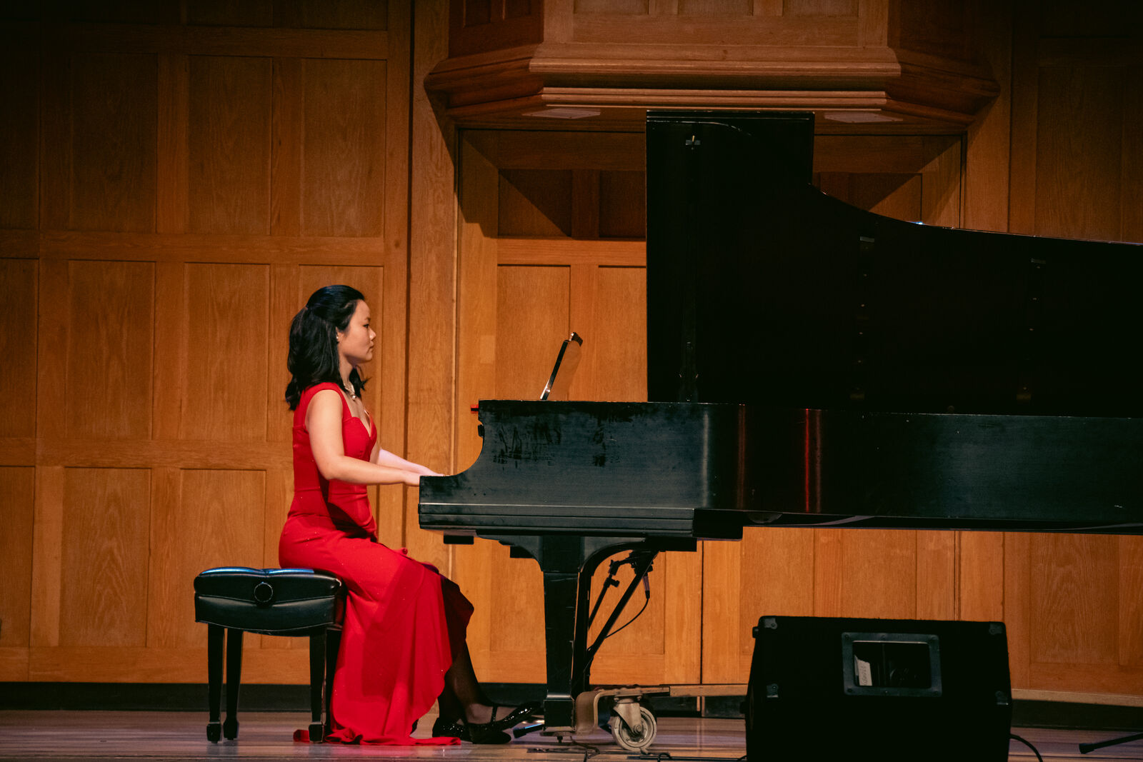 Song Chen performing at a grand piano on a concert stage